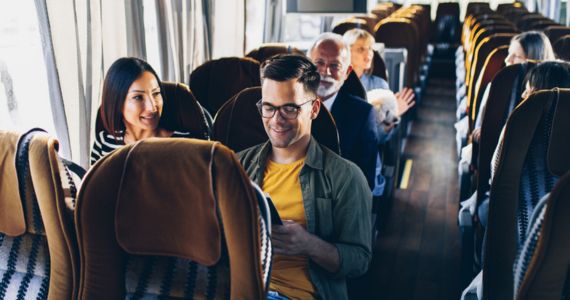 passengers happily on a bus